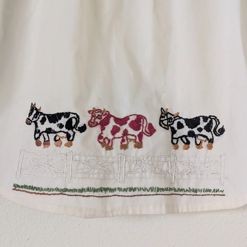 Vintage Hand Embroidered Child's Apron, Cream with Black and Red Cows